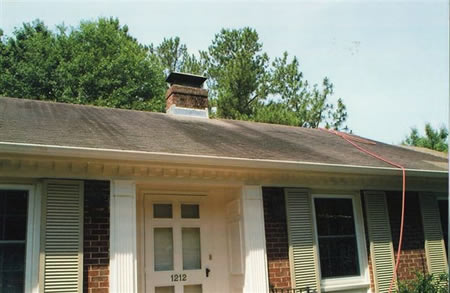 Soft wash roof cleaning removing black algae streaks from asphalt shingles in Rocky Mount, NC